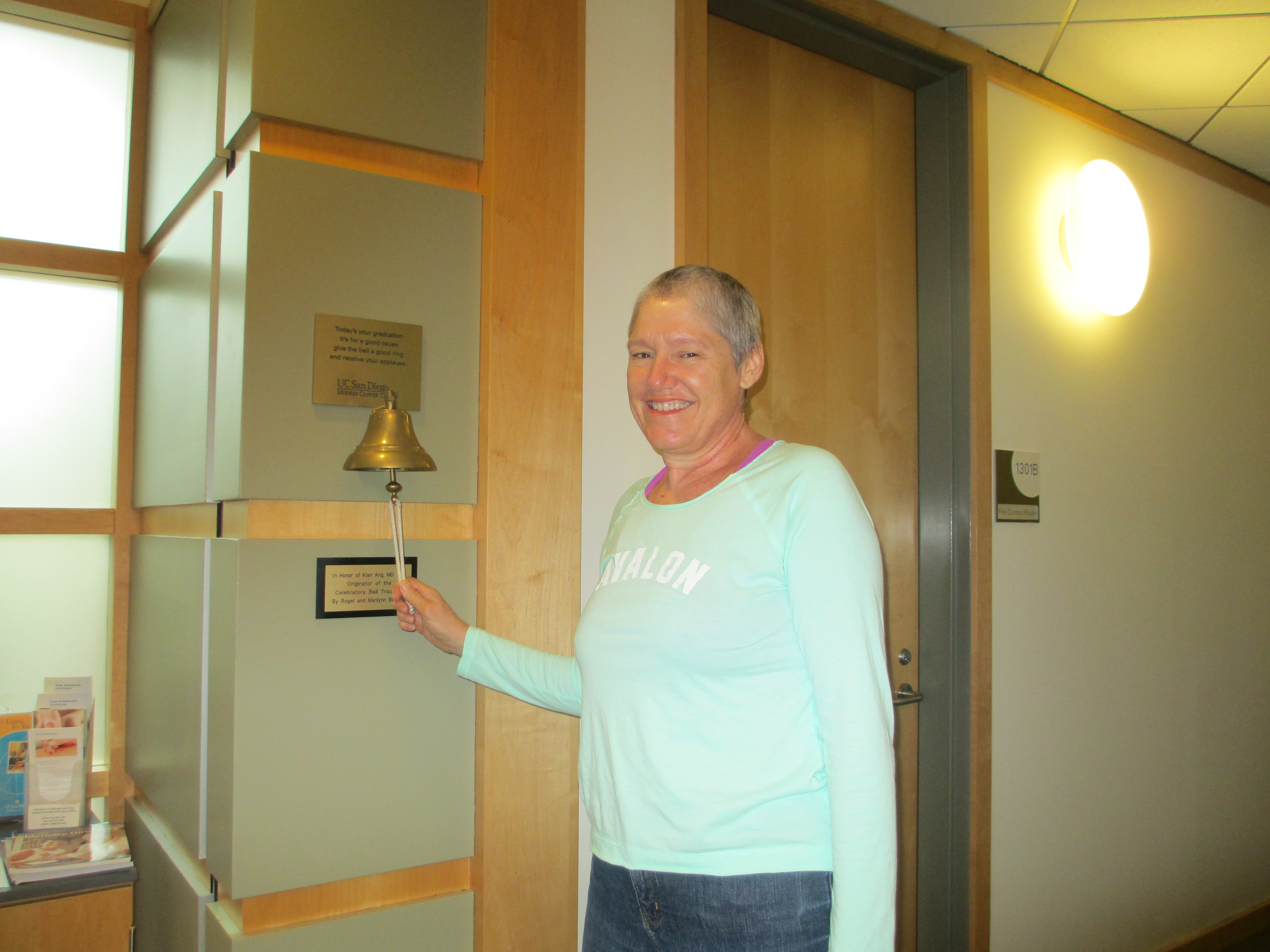 Ringing the "I'm done!" bell in the radiation oncology unit at UCSD Medical.